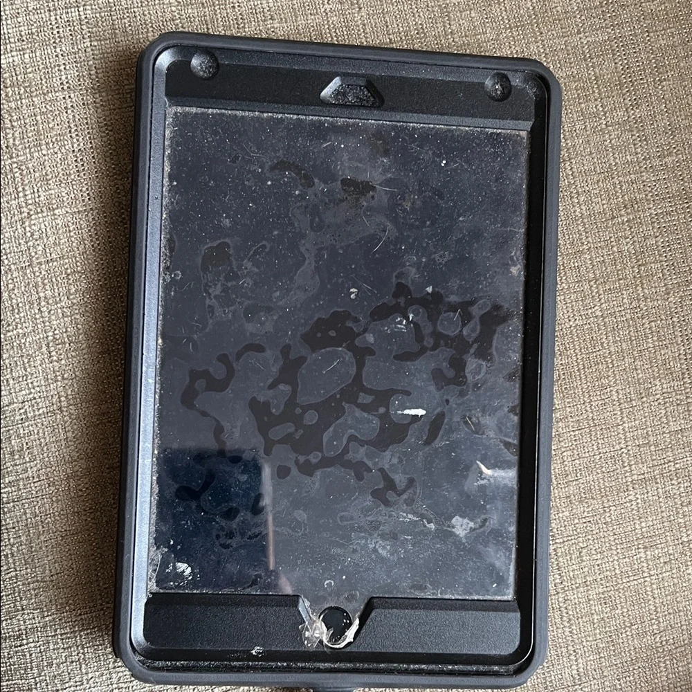 Apple IPad Mini with black otter box case